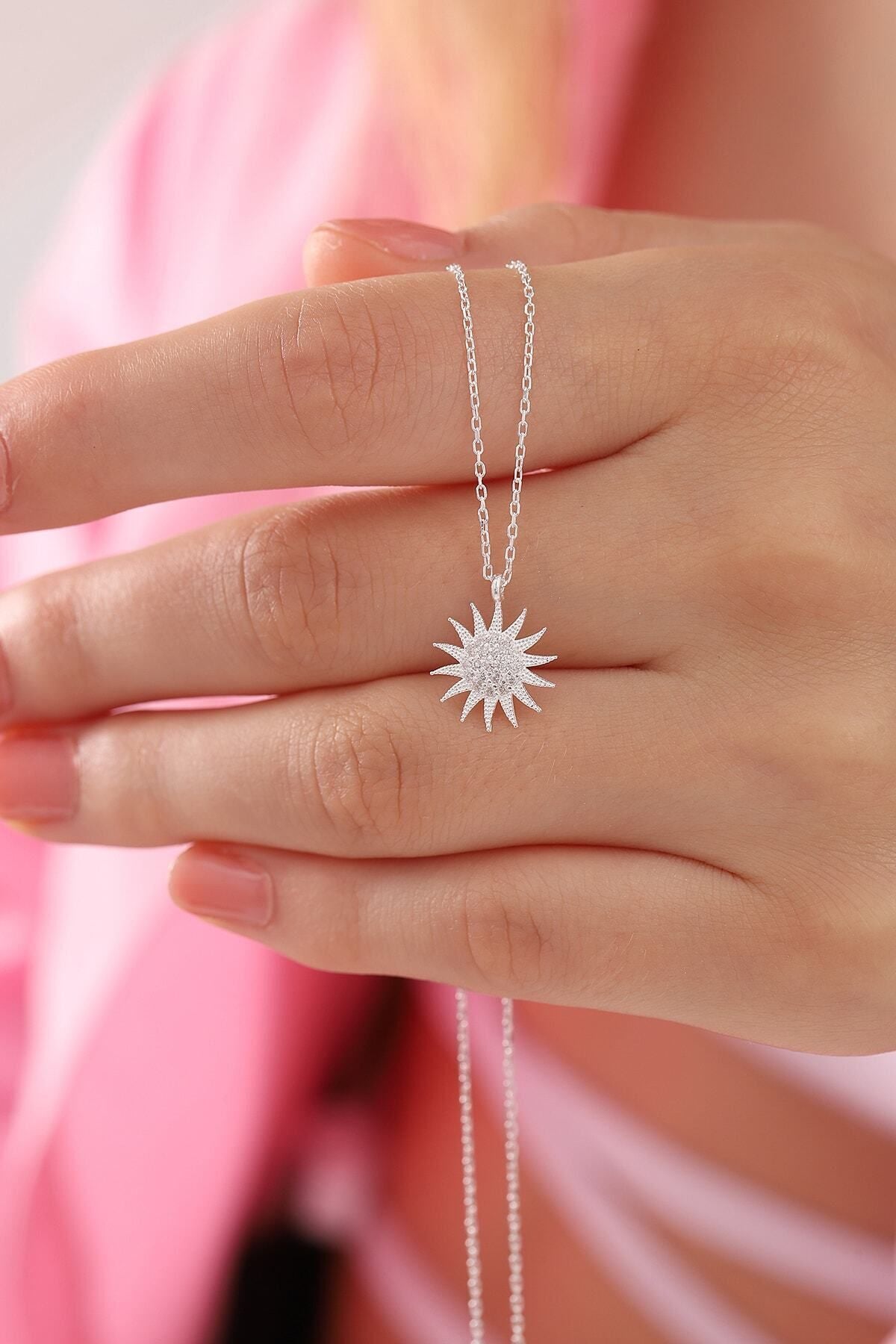 silver sun pendant necklace detail