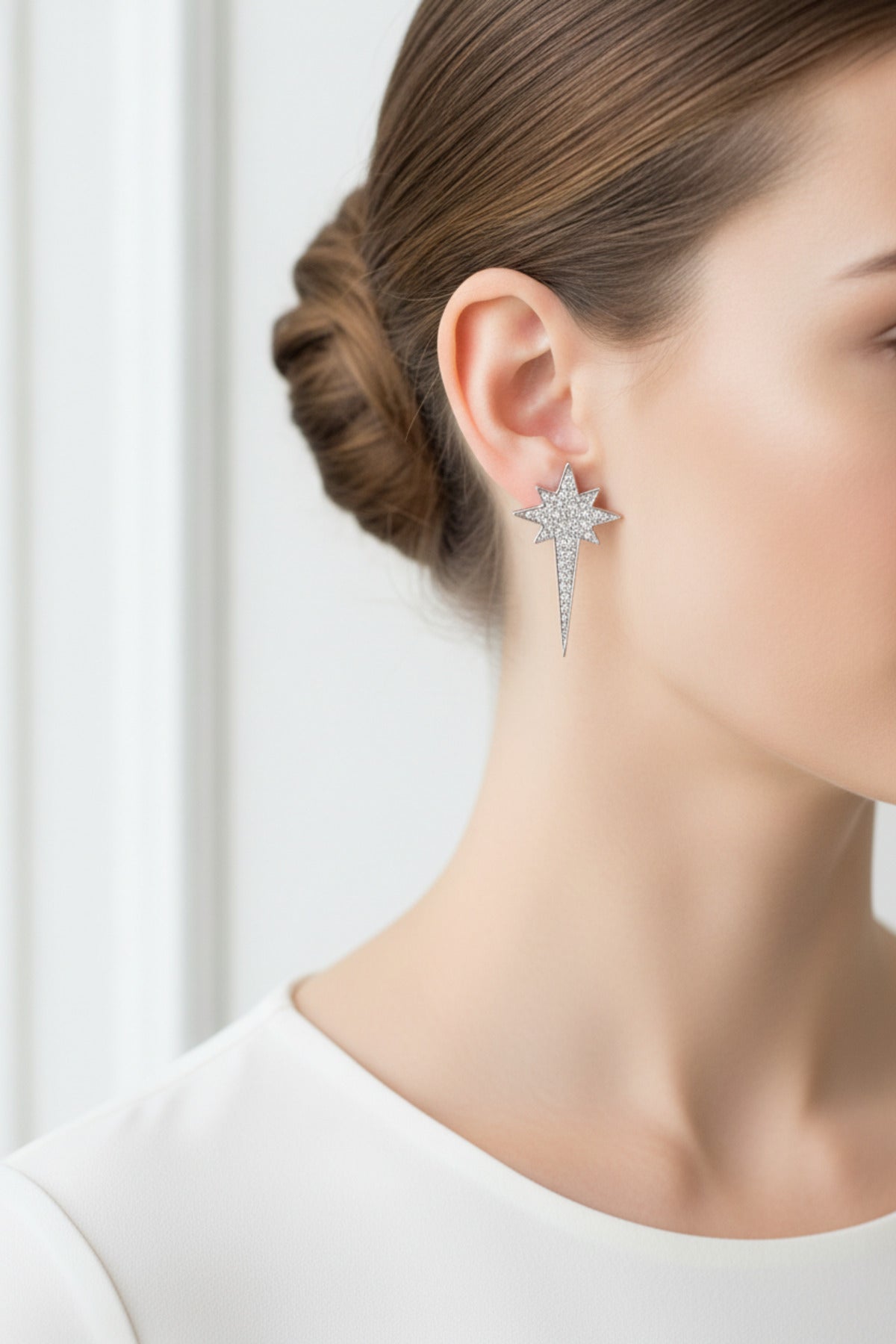 silver star earrings detail